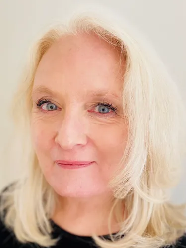 Head shot of Clare Ryan wearing a black top.